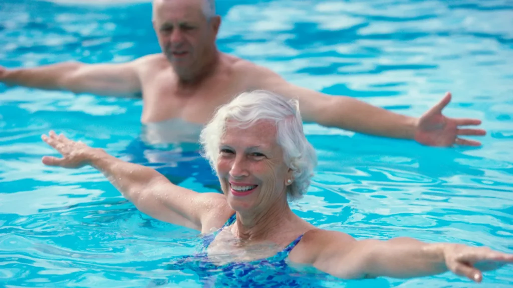 Senior couple enjoying a low-impact pool workout