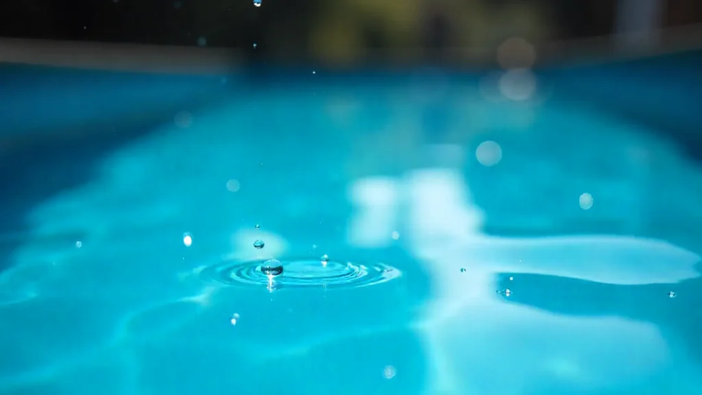 Close-up of water drops on the surface of a swimming pool