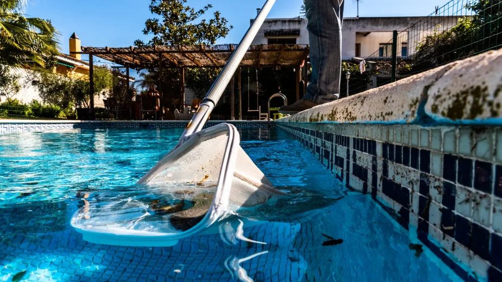 Clean poolside deck area maintained by amenity pool services, preventing hard water damage