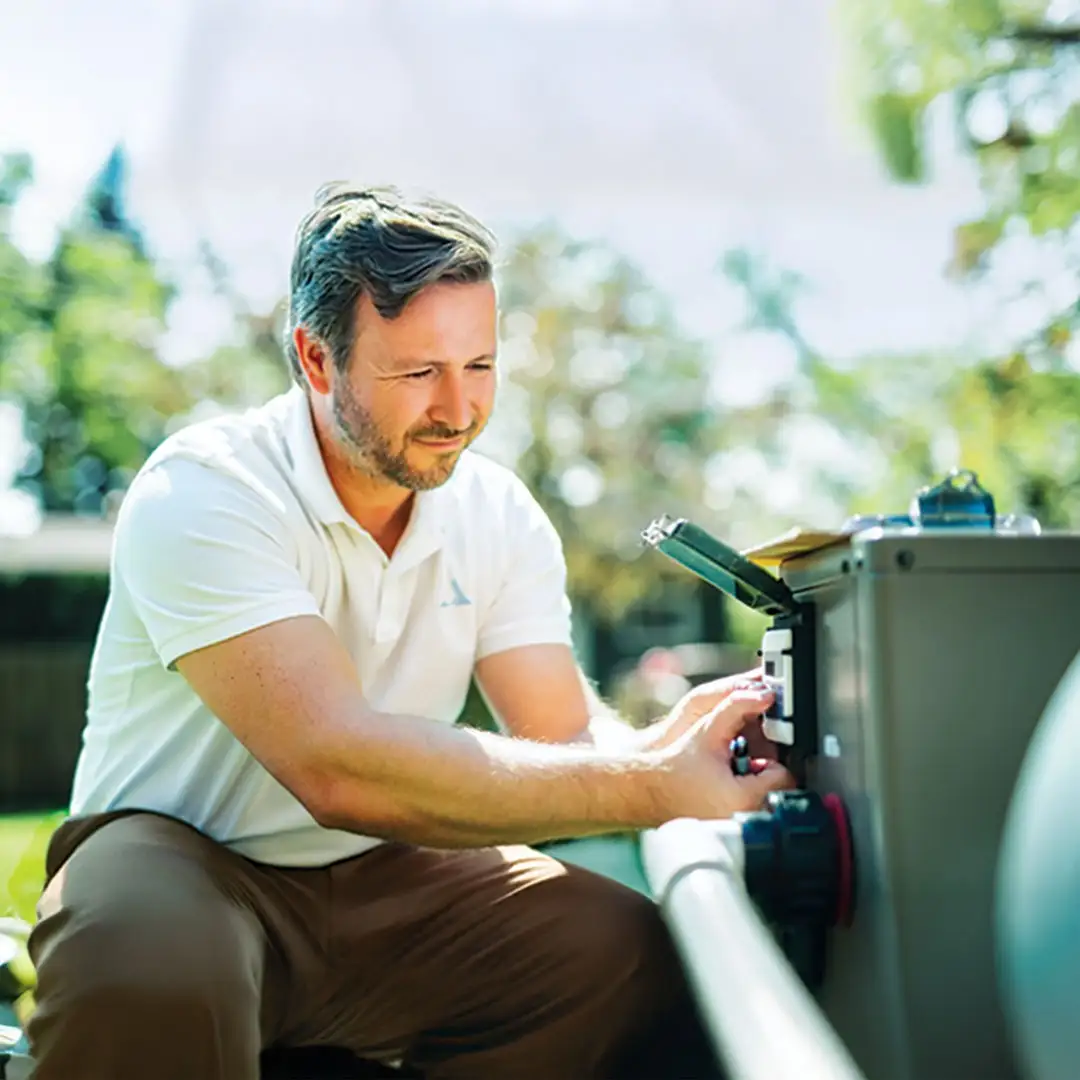 An Amenity Pool Technician working on a pool pump