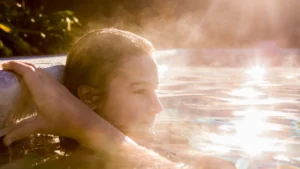 Woman standing in a pool near a pool heater in Fortworth, TX