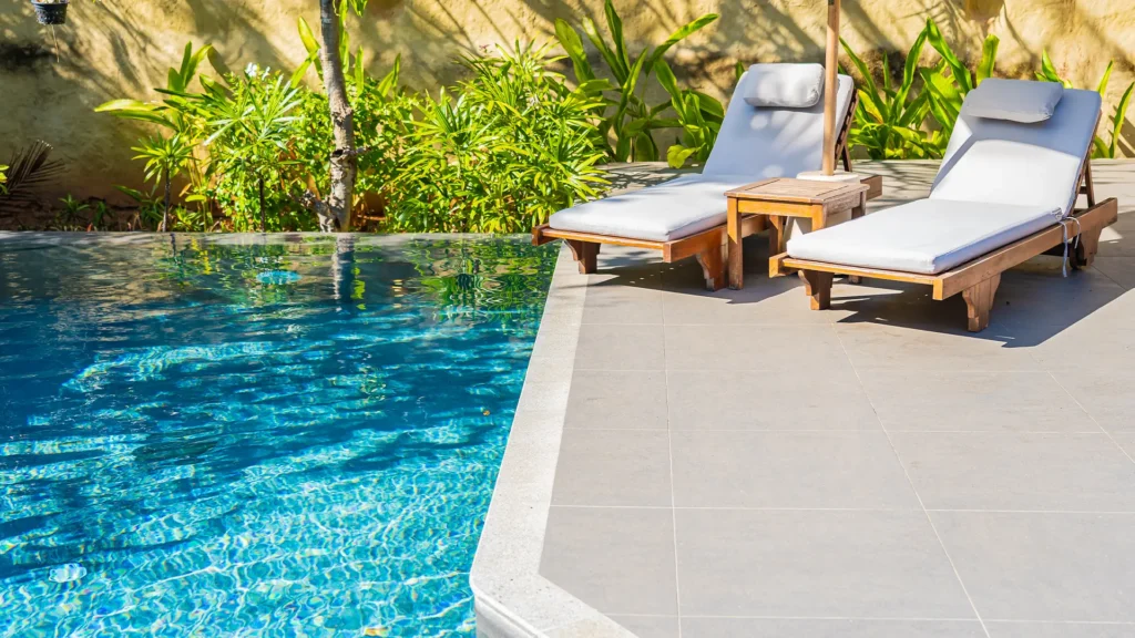 Sunny backyard pool looking pristine in Phoenix