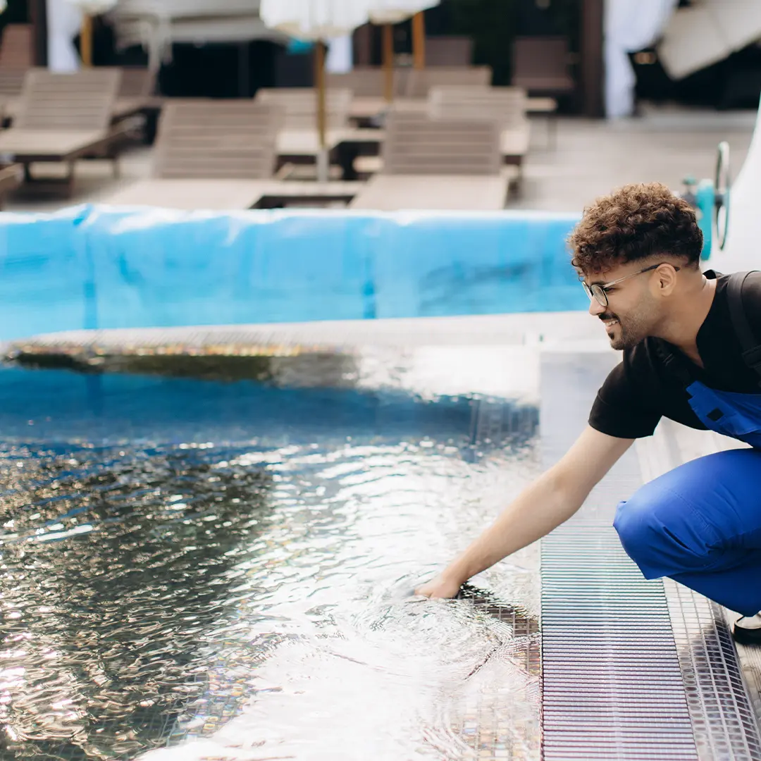 Skilled pool technician inspecting heating equipment