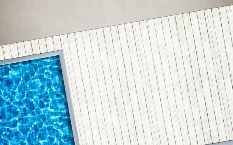 Wood-look pool border design for a natural and modern aesthetic